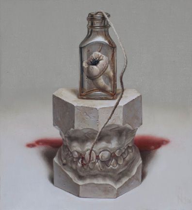 A glass bottle containing a tooth rests atop a gray dental cast, with a trailing cord and red smear behind.