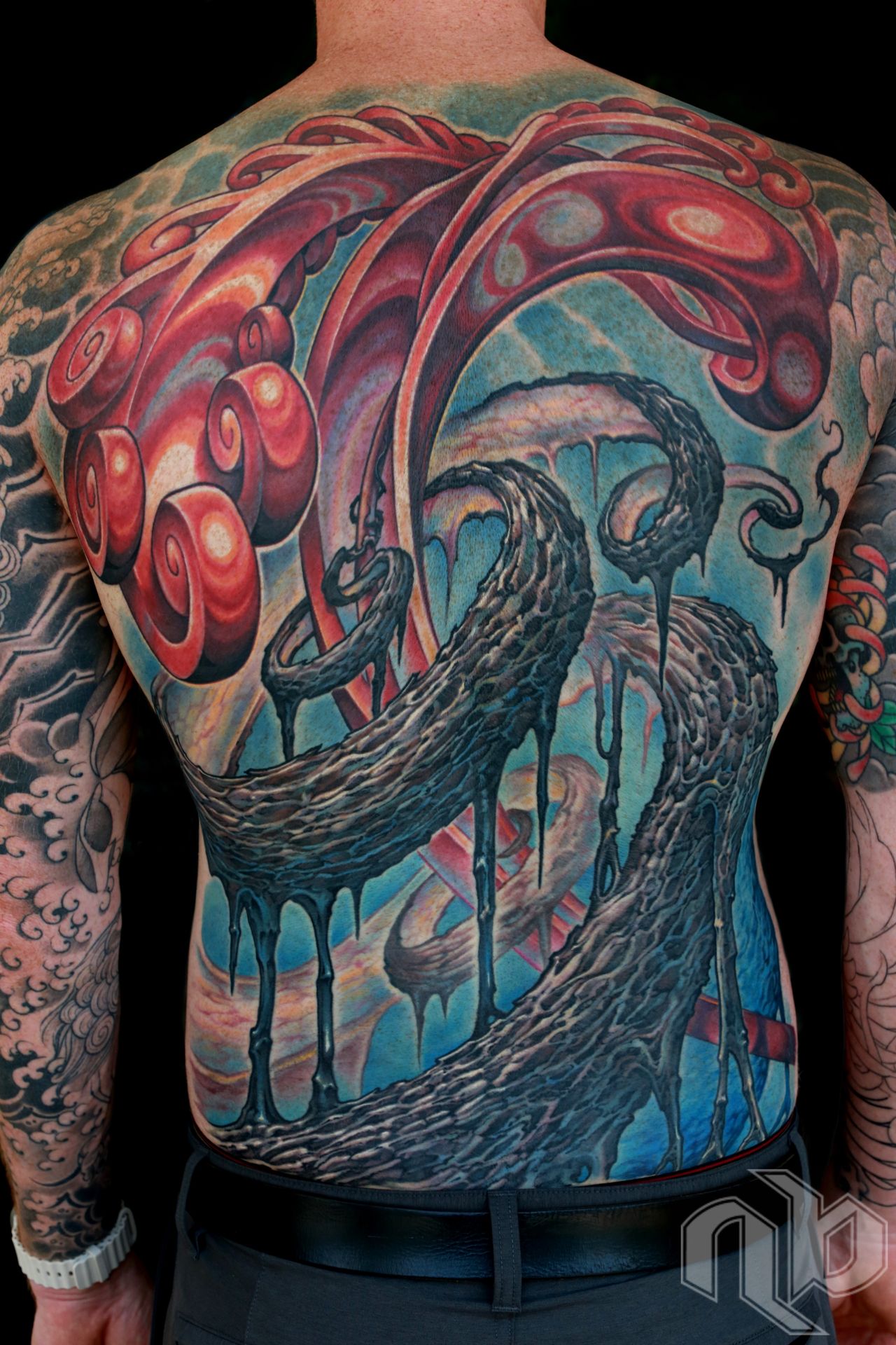 Color textured abstract bio-organic tattoo backpiece with roots, vines, and shiny spiral growth by Nick Baxter in Austin Texas